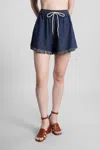 Zimmermann Rhiannon Drawstring Waist Fringe Hem Denim Shorts In Blue