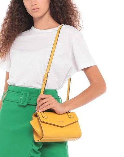 Shop Pollini Handbags In Ocher