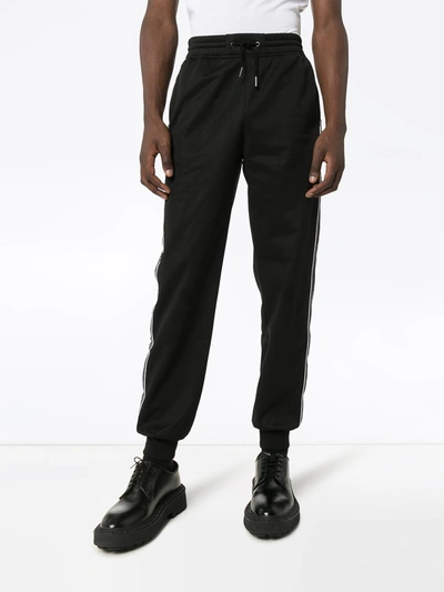 Shop Givenchy Logo Trousers In Black