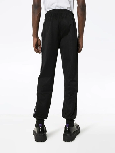 Shop Givenchy Logo Trousers In Black