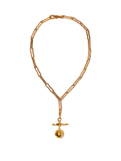 A SET OF THREE : A GOLD PLATED CURIOSITÉ NECKLACE , A GOLD PLATED