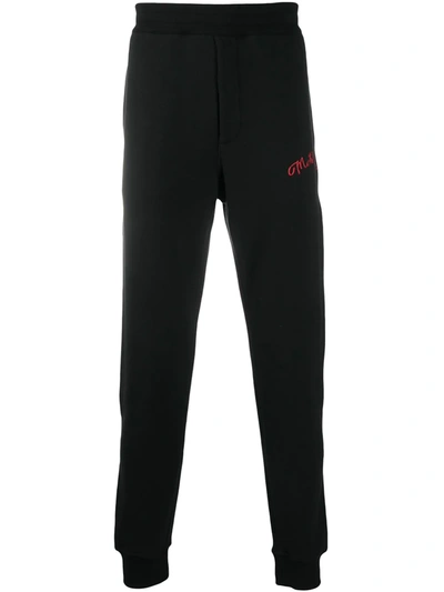 Shop Alexander Mcqueen Embroidered Logo Track Trousers In Black