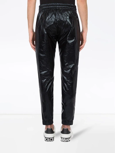 Shop Dolce & Gabbana Waxed Loose-fit Trousers In Black
