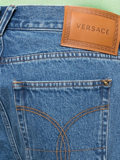 Shop Versace Wide-leg Cropped Jeans In Blue