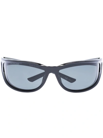 Shop Balenciaga Bb0121s1 Oval-frame Sunglasses In Black