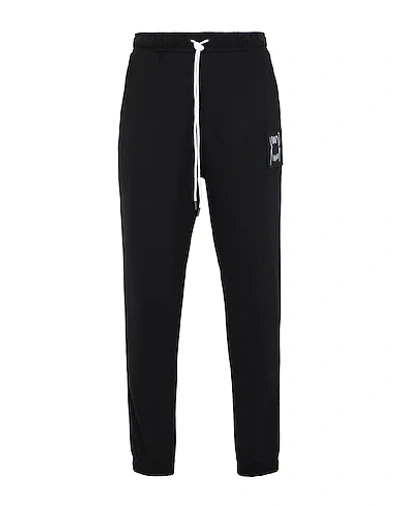 Shop Puma Pants In Black