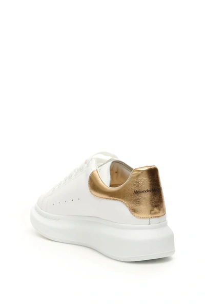 Shop Alexander Mcqueen Oversize Sneakers In White/gold