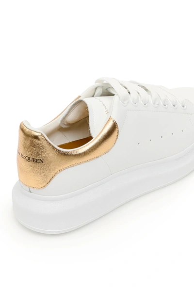 Shop Alexander Mcqueen Oversize Sneakers In White/gold