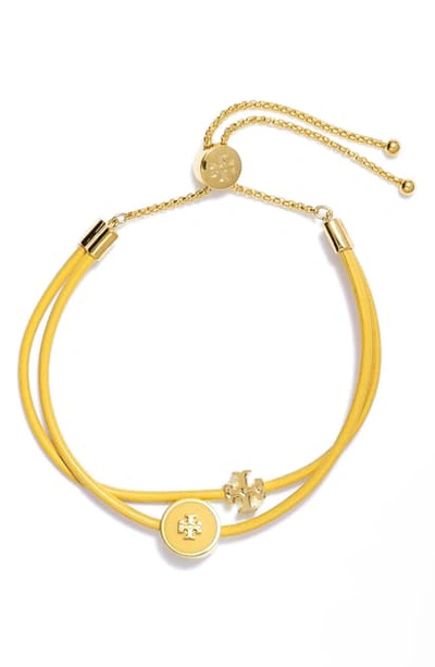 Shop Tory Burch Enamel Logo Slider Bracelet In Tory Gold / Lemon Drop