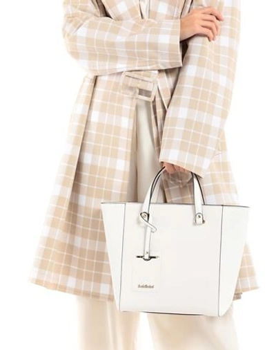 Shop Baldinini Handbags In White