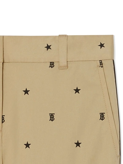 Shop Burberry Star Monogram-motif Trousers In Brown