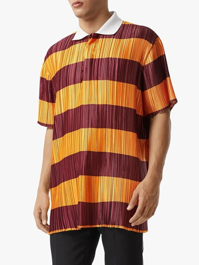 Shop Burberry Striped Plissé Polo Shirt In Orange