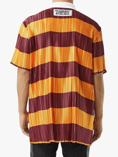 Shop Burberry Striped Plissé Polo Shirt In Orange