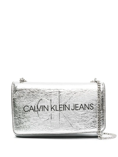 Shop Calvin Klein Logo Print Metallic Crossbody Bag In Silver