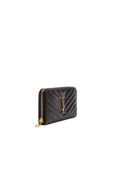 Shop Saint Laurent Monogramme Zip Around Wallet In Black