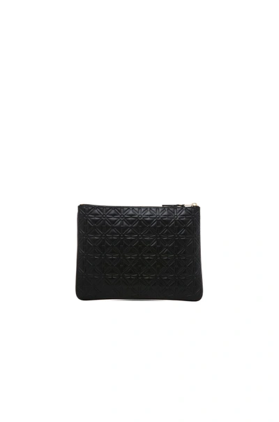 Shop Comme Des Garçons Comme Des Garcons Star Embossed Pouch In Black, Geometric Print.