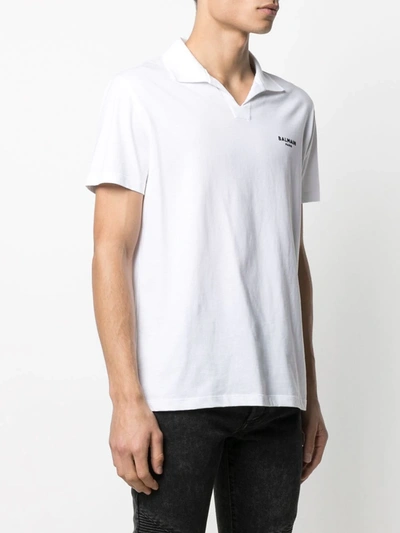 Shop Balmain Flocked Logo Polo Shirt In White