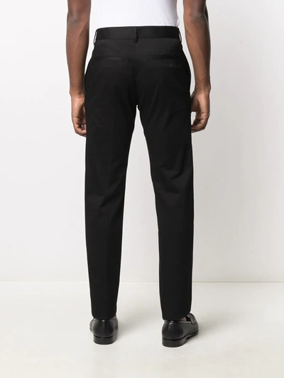 Shop Versace Embroidered Logo Tailored Trousers In Black