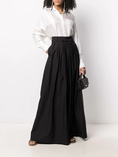 Shop Brunello Cucinelli Pleated Wide Leg Trousers In Black