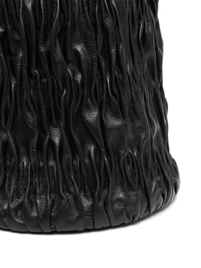 Shop Ganni Matellasé Drawstring Pouch In Black