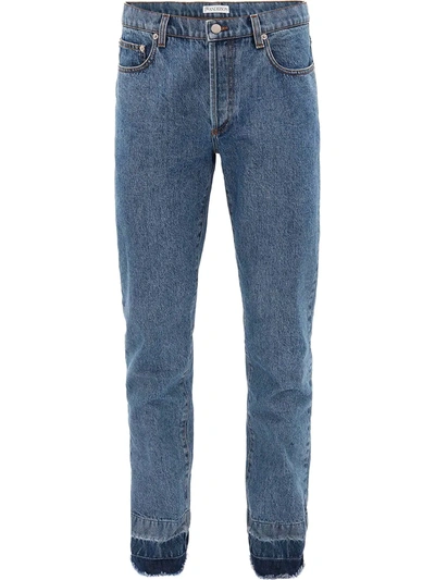 Shop Jw Anderson Raw-hem Slim Jeans In Blue