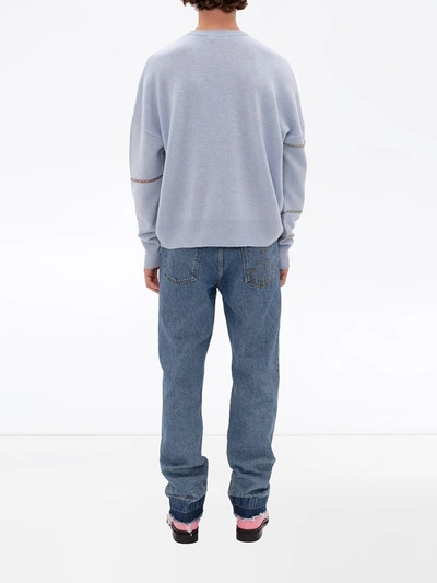 Shop Jw Anderson Raw-hem Slim Jeans In Blue