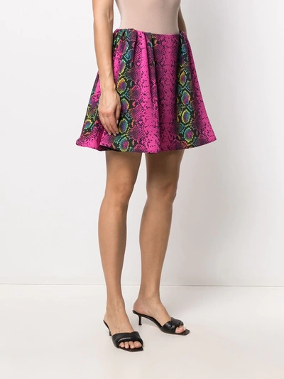 Shop Versace Snakeskin Print Skater Skirt In Pink