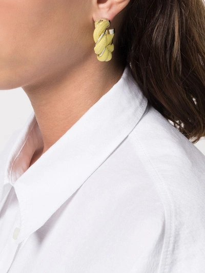 Shop Bottega Veneta Twist Hoop Earrings In Yellow