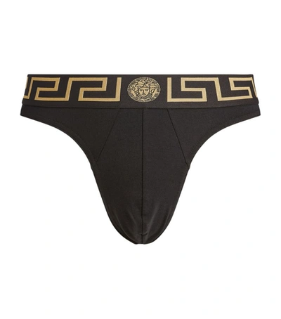 Shop Versace Ver Thong Iconic Greca Wb