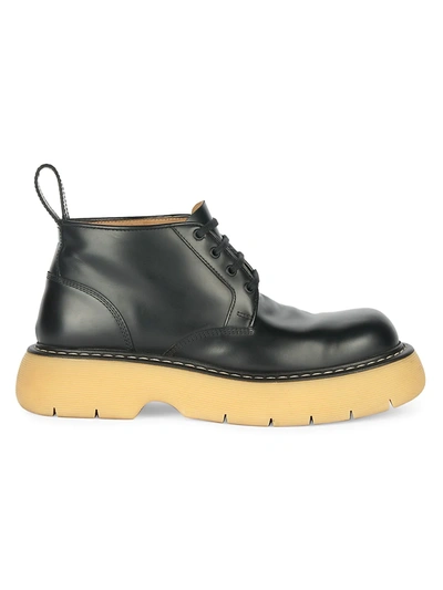 Shop Bottega Veneta The Bounce Lug-sole Leather Boots In Black Natural