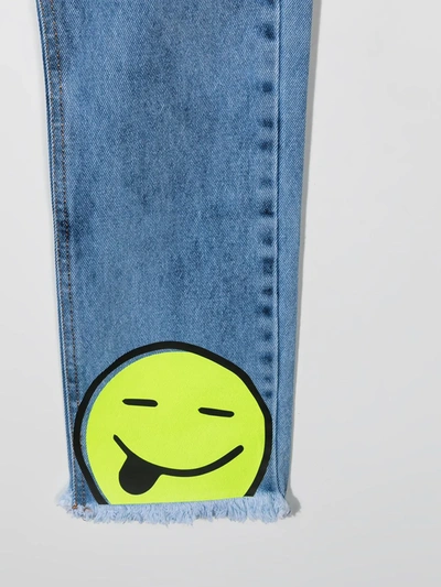 Shop Duoltd Tongue Out Smile Jeans In Blue