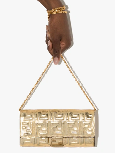 Shop Fendi Ff-logo Baguette Clutch Bag In Gold