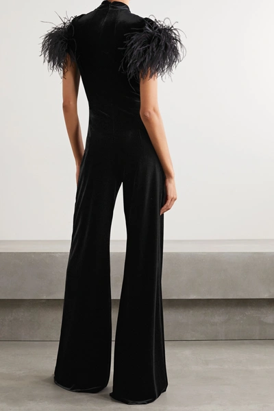 Shop 16arlington Kohana Feather-trimmed Knotted Velvet Jumpsuit In Black
