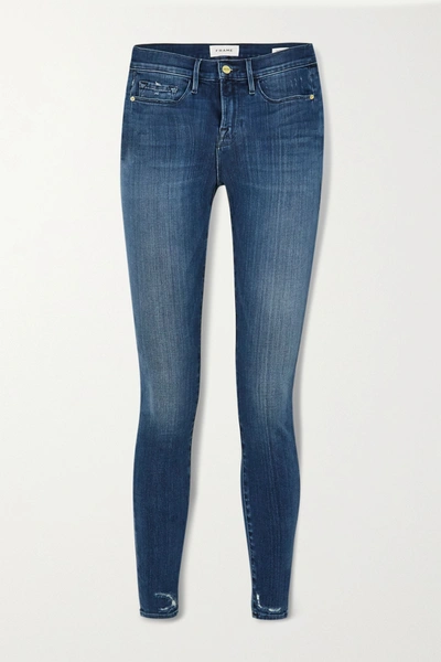 Shop Frame Le Skinny De Jeanne Distressed Mid-rise Jeans In Mid Denim