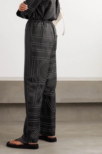 Shop Totême Vizelle Embroidered Silk-satin Wide-leg Pants In Black