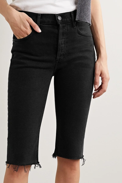 Shop Agolde Carrie Frayed Denim Shorts In Black