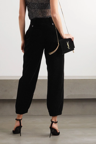 Shop Saint Laurent Velvet Tapered Pants In Black