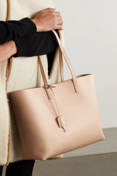 Shop Saint Laurent East West Large Leather Tote In Beige