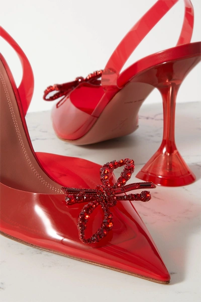 Shop Amina Muaddi Rosie Glass Crystal-embellished Bow-detailed Pvc Slingback Pumps In Red