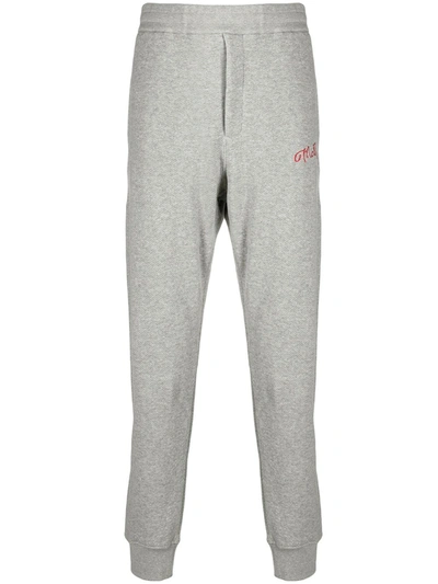 Shop Alexander Mcqueen Embroidered Logo Track Trousers In Grey