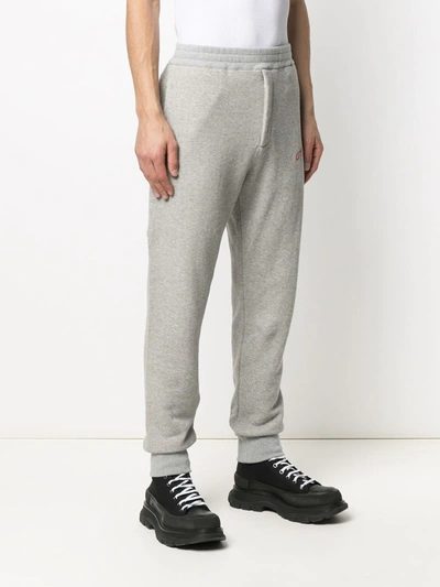 Shop Alexander Mcqueen Embroidered Logo Track Trousers In Grey