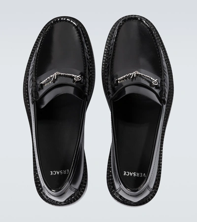 Shop Versace Gv Signature Leather Loafers In Black