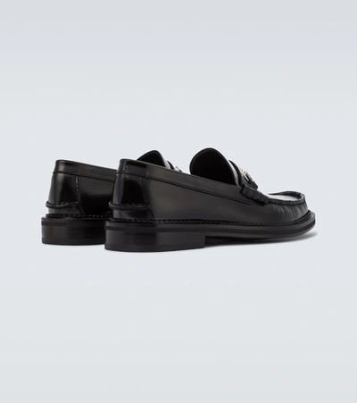 Shop Versace Gv Signature Leather Loafers In Black