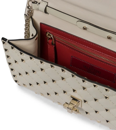 Shop Valentino Rockstud Spike Small Crossbody Bag In White