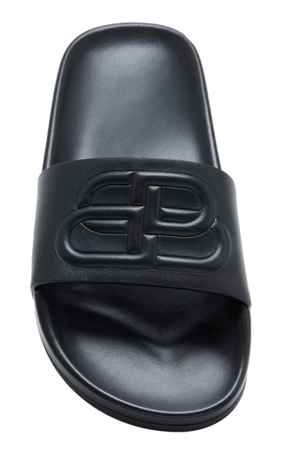 Shop Balenciaga Logo-embossed Leather Slides In Black