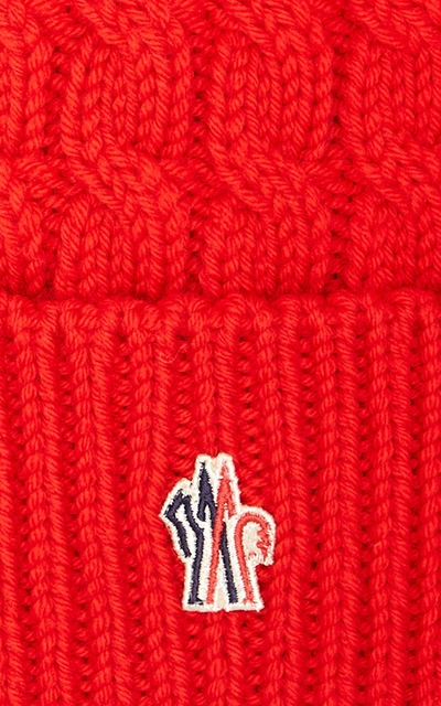 Shop Moncler Fur-trimmed Cable-knit Wool Beanie In Red