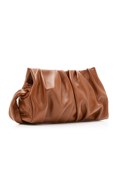 Shop Elleme Vague Ruched Patent Leather Shoulder Bag In Brown