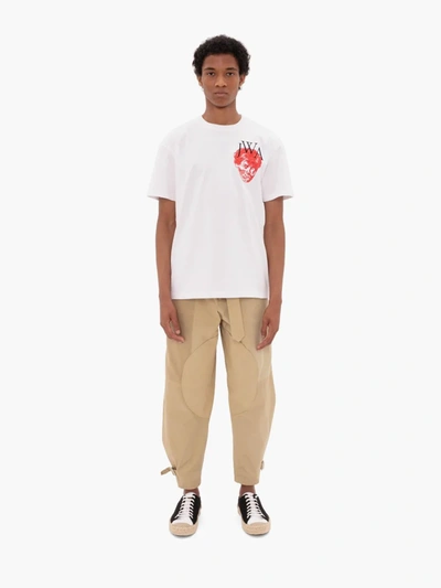 Shop Jw Anderson Tapered Trousers In Neutrals