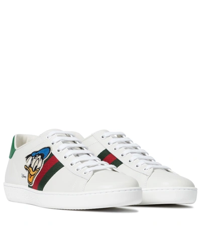 Shop Gucci X Disney® Ace Leather Sneakers In White