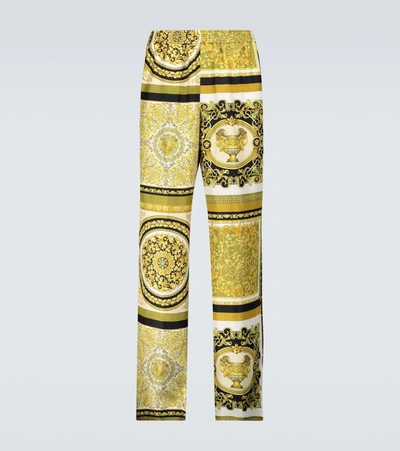 Shop Versace Baroque Printed Silk Pants In Gold